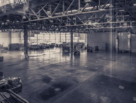 Interior of an empty warehouse with glass wall Ilustración de archivo