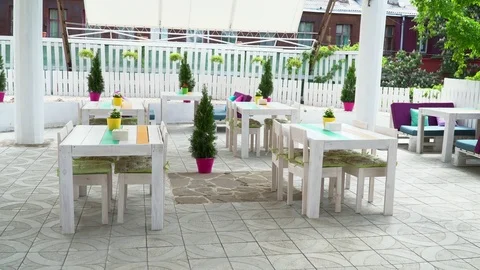 Interior of the empty white summer restaurant outdoors Stock Footage 77027077