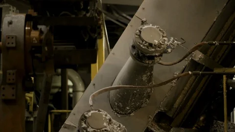 Interior Factory - Pan to Robotic Scoop for Steel Manufacturing Stock Footage 89985752