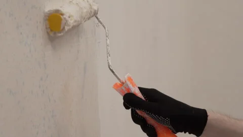 Interior finishing work during renovations. Close-up of a painter holding a.. Stock Footage 337450224