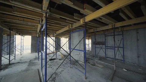 Interior formwork with scaffolding in unfinished building Stock Footage 327612835