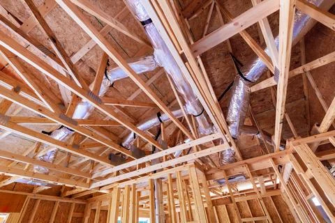 Interior framework of residential building under construction works ductwork Fotos de archivo