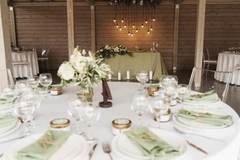 The interior of the gala dinner is a table decorated with flowers, light bulb Stock Photos