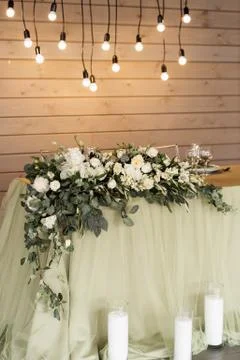 The interior of the gala dinner is a table decorated with flowers, light bulb Stock Photos