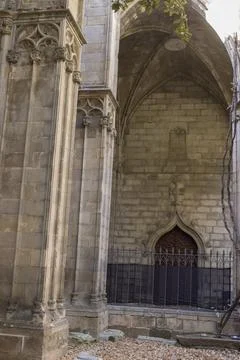 Interior of a gothic temple with large stone columns and an arched door Stock Photos