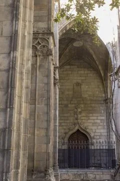 Interior of a gothic temple with large stone columns and an arched door Stock Photos