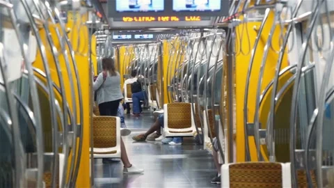 Interior Of A Half-Empty Subway Train With Connected Cars Stock Footage 167744623