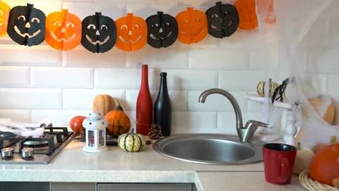Interior Halloween with pumpkins and spider in the kitchen. Stock Footage 162211490