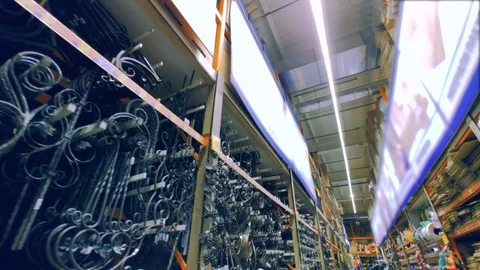 Interior of a hardware store with wrought products on the shelves. Dolly shot Stock Footage 95919298