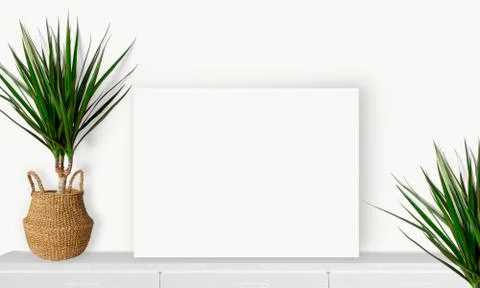 Interior horizontal rectangular poster mockup standing on the table with plan Stock Photos