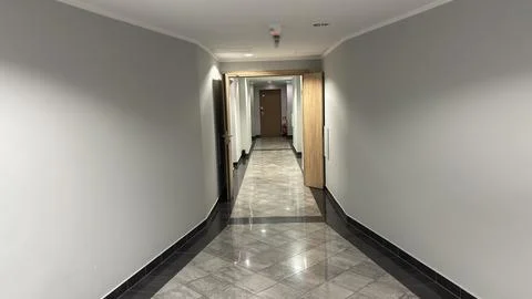 Interior hotel Tiled corridor inside a hotel. corridor residential apartment Stock Photos