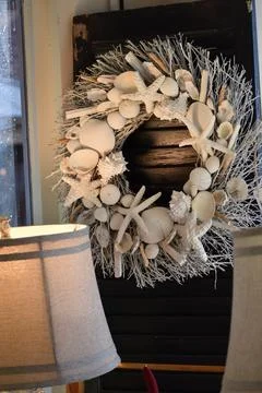 Interior image of lamp and seashell wreath Stock Photos
