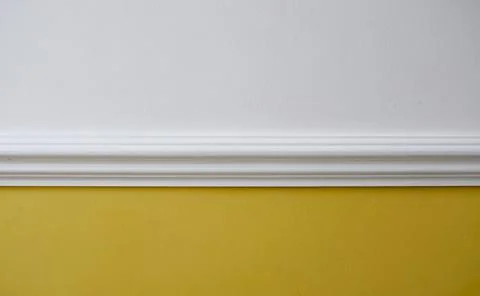 Interior image of white dado rail with yellow below and white above Stock Photos