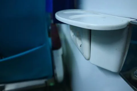 Interior inside an executive train. electric plugs. drinking stand. Stock Photos