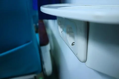 Interior inside an executive train. electric plugs. drinking stand. Stock Photos