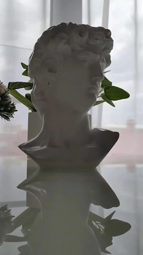 Interior items, breakfast, David's head statue Video stock 314375412