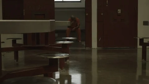 Interior Jail Cell with Inmate 2 Stock Footage 87755645