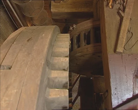 Interior Kinderdijk windmill cogwheels turning + groaning of the timber Stock Footage 112987433