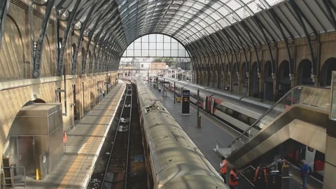 Interior of Kings Cross train station with train departing from platform Stock Footage 94494766