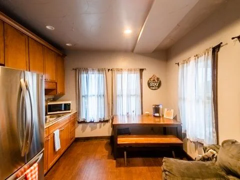 Interior of kitchen and dining area of small apartment home. Stock Photos