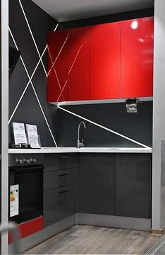 Interior kitchen black with red touches prepared to release with an exit door Stock Photos
