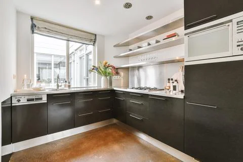 Interior of kitchen with flowers Stock Photos