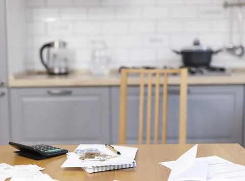 The interior of the kitchen, on the kitchen table there are papers, money Stock Photos