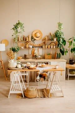 Interior of kitchen is made of wood with elements of eco style. autumn decor. Stock Photos