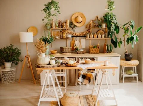 Interior of kitchen is made of wood with elements of eco style. autumn decor. Stock Photos