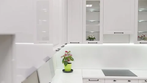 Interior of a kitchen set with shelves and a sink with a stove. Modern white Video stock 256991281