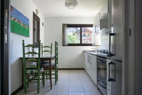 Interior of a kitchen with a table and chairs. Stock Photos