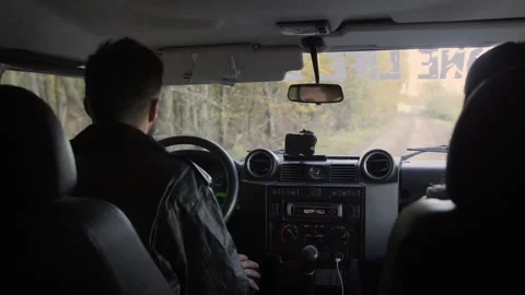 Interior of a Land Rover Defender SUV driven by a Caucasian young man. Video stock 234543028