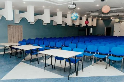 Interior of large classroom, student class at institute, conference hall Stock Photos
