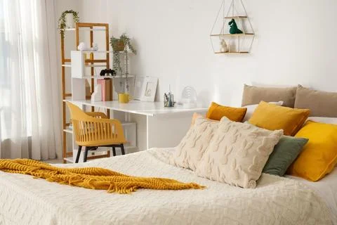 Interior of light children's room with bed and study table Stock Photos