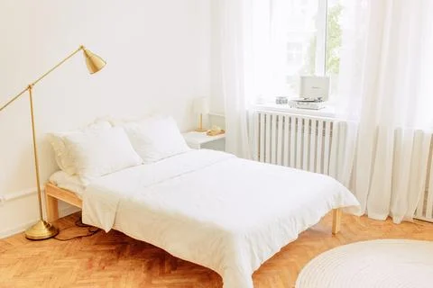 Interior of light living room with sofas, rattan table and soft carpet Stock Photos