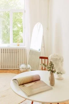 Interior of light living room with sofas, rattan table and soft carpet Stock Photos