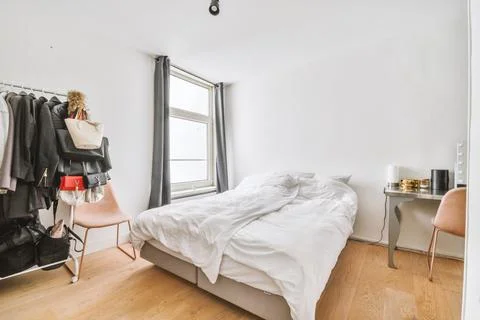 Interior of light modern bedroom Stock Photos