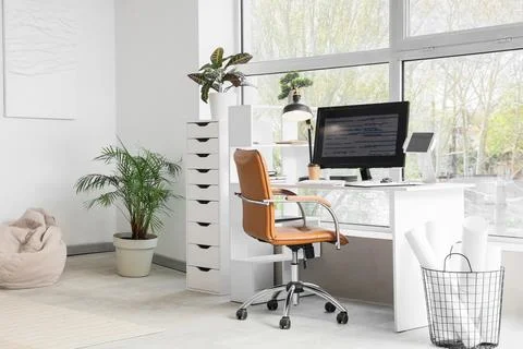 Interior of light office with programmer's workplace and plants Stock-Fotos