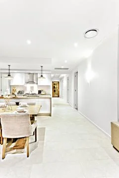 Interior lights at night with a kitchen and dining Stock Photos