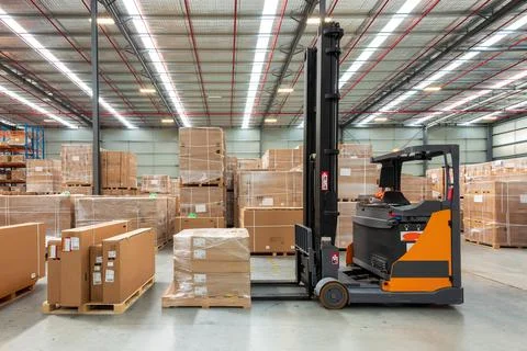 Interior of Logistics warehouse with forklift Stock Photos