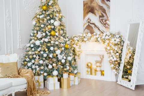 Interior of luxury interior with fireplace, comfortable sofa and chandelier Stock Photos