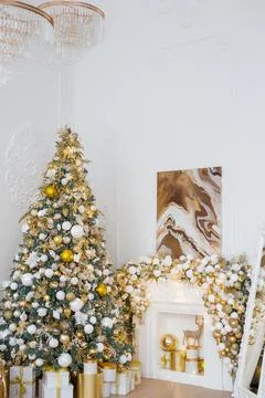 Interior of luxury interior with fireplace, comfortable sofa and chandelier Stock Photos