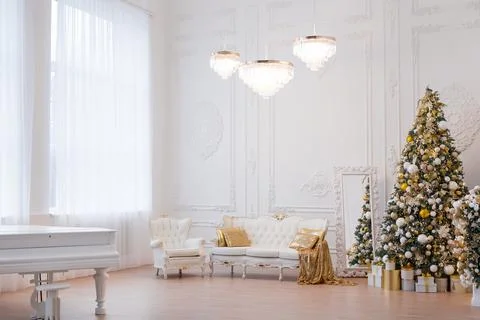 Interior of luxury interior with fireplace, comfortable sofa and chandelier Stock Photos