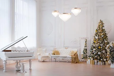 Interior of luxury interior with fireplace, comfortable sofa and chandelier Stock Photos