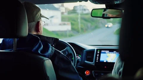Interior of a man driving through east coast town Stock Footage 77766417