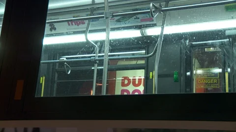 Interior of Metropolitan Transit Authority bus parked on NYC street, night. Video stock 108048647