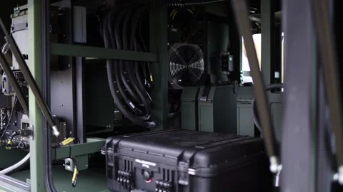 Interior of military command vehicle filled with cables power units control modu Stock Footage 311661970