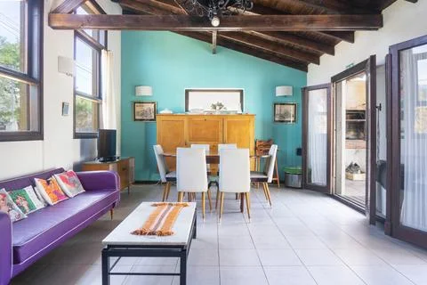 Interior of a modern dining room with a table and chairs. Stock Photos