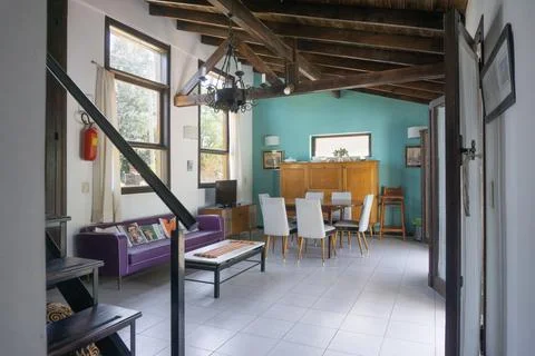Interior of a modern dining room with a table and chairs. Stock Photos