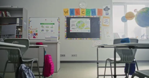 Interior of Modern Empty Elementary School Classroom with Desks for Students Stock Footage 315533156